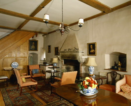 View towards stone fireplace in the solar or withdrawing room at Compton Castle, Devon - National Trust Images