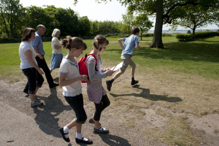 Visitors in the garden at Speke Hall, Liverpool.