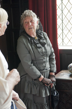 Volunteer in costume at Speke Hall, Liverpool.