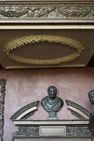 Broken pediment and bust over a door in the Great Staircase at Ham House, Richmond upon Thames, Surrey.