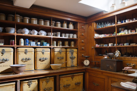 Storage tins on shelves in the Dry Store at Wimpole Hall, Cambridgeshire.